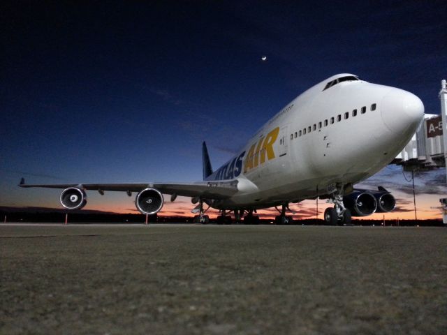 Boeing 747-400 (N465MC) - The sun sets on a special guest at TLH. This Atlas Air B744 departs as GTI8067 carrying FSU band and boosters to Pasadena for the National Championship.