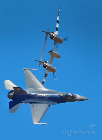 — — - U.S.Air Force F-16 Fighting Falcon and a Lockheed P-38 Lighting in a heritage flight  execute a break formation at Mather field, Capitol Air Show 2012 Rancho Cordova, Ca.