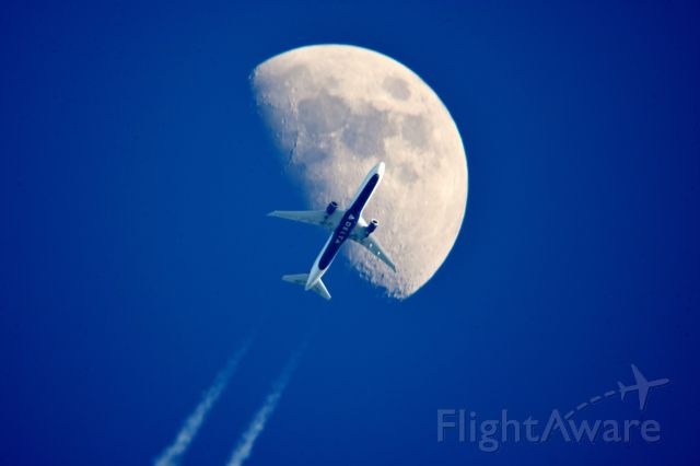 BOEING 767-400 (N829MH) - This is Delta Flight 563 a Boeing 767-432 New York to Los Angeles south of Cleveland Ohio at 32,000 ft 487 mph crossing the Waxing Gibbous Moon 63% Illumination 5:10 pm 02.09.22.