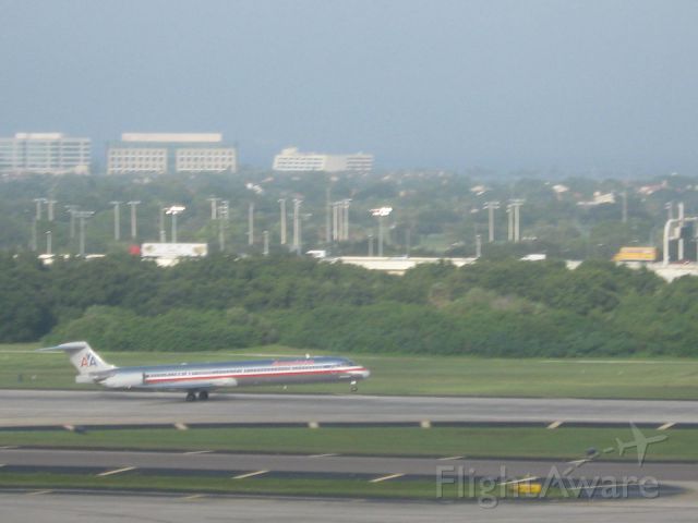 McDonnell Douglas MD-90 — - American MD-90 rotating on rwy. 1L at Tampa, with Tampa Stadium in the background.