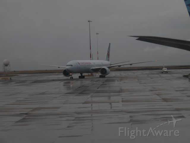 BOEING 777-300ER — - B77W Rainy day in CYVR