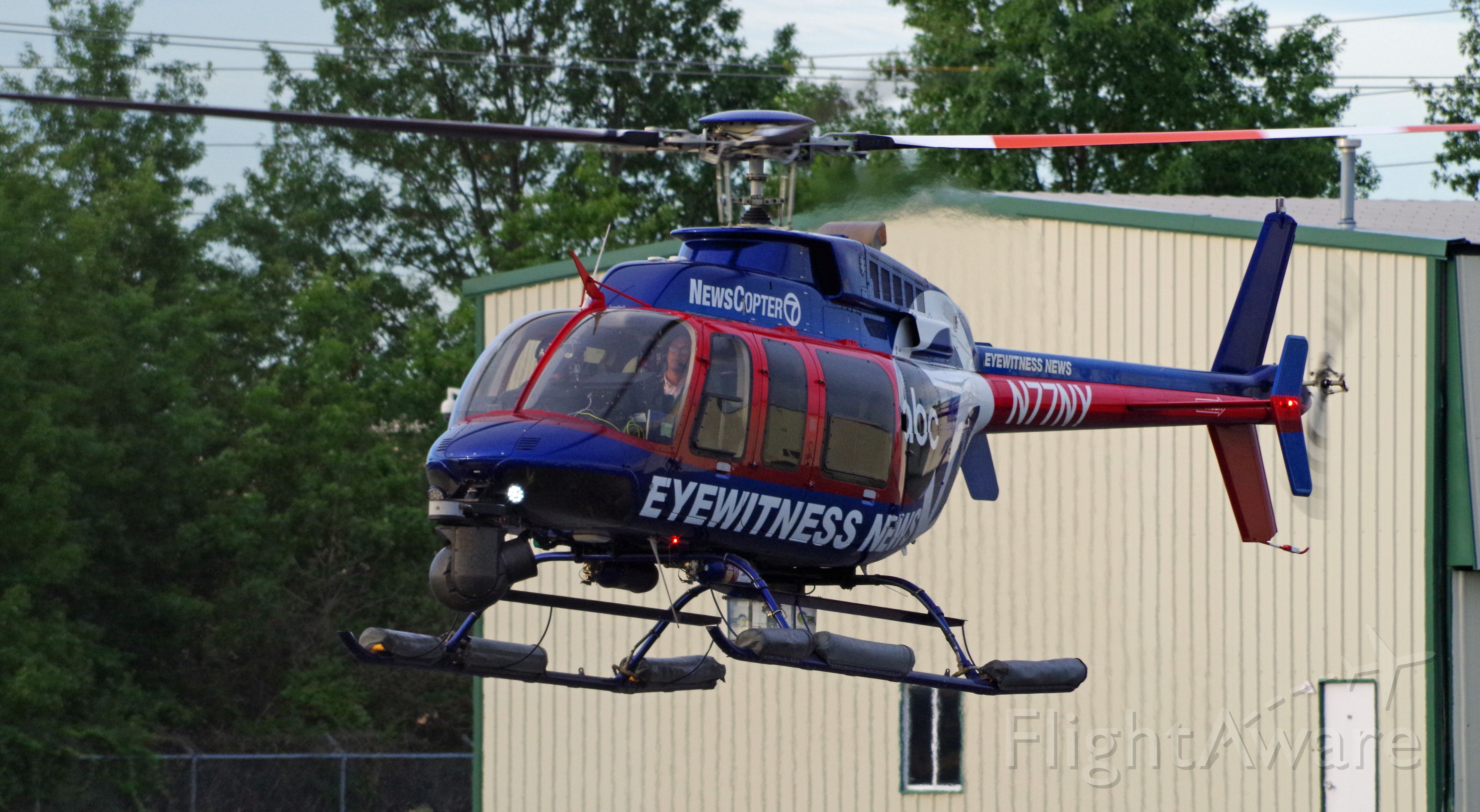 Bell 407 (N77NY) - LINDEN AIRPORT-LINDEN, NEW JERSEY, USA-AUGUST 31, 2020: A news helicopter from one of the local New York City television stations is seen preparing to land after completing its first flight of the morning.