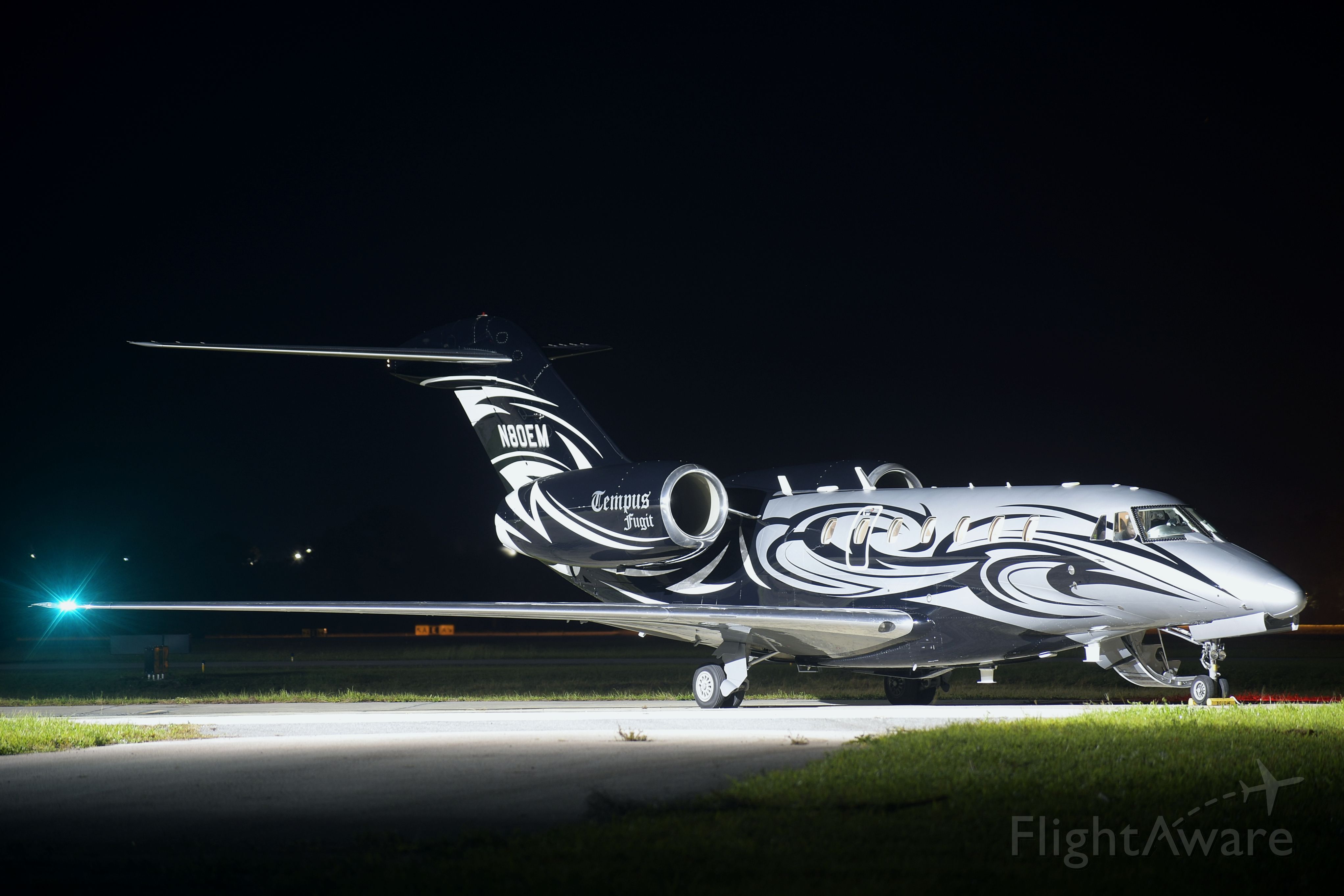 Cessna Citation X (N80EM) - "Tempus Fugit" on the ramp shortly before a nighttime departure from the Space Coast on November 15, 2020.