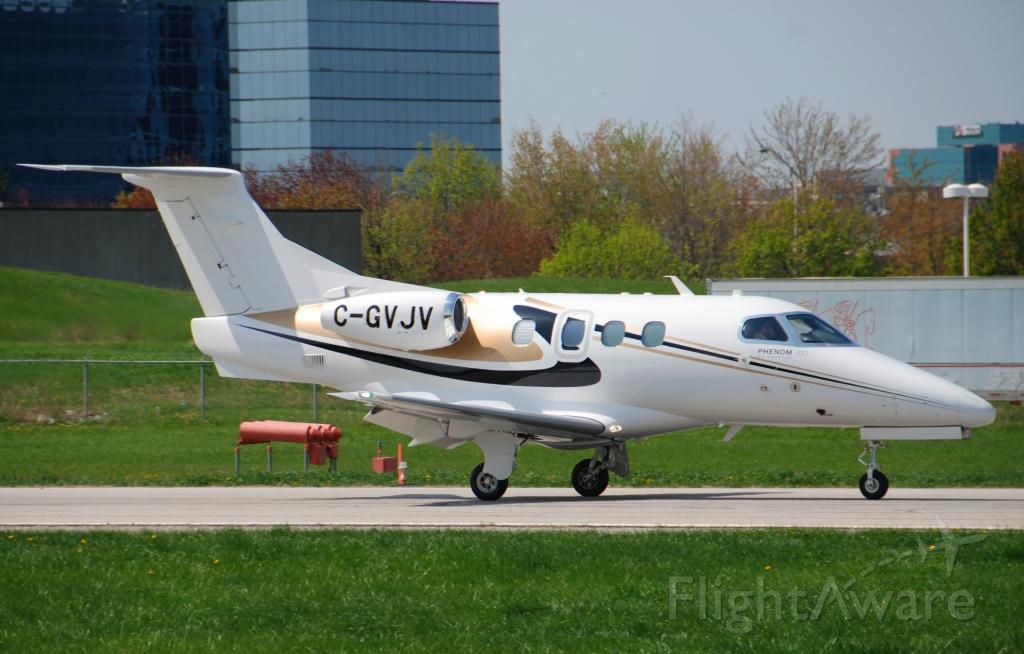 Embraer Phenom 100 (C-GVJV) - JV's Phenom 100 C-GVJV arriving @ Toronto's Buttonville - just arrived from Washington Dulles - and heading home to Lake Simcoe Regional Airport - May 19 2014