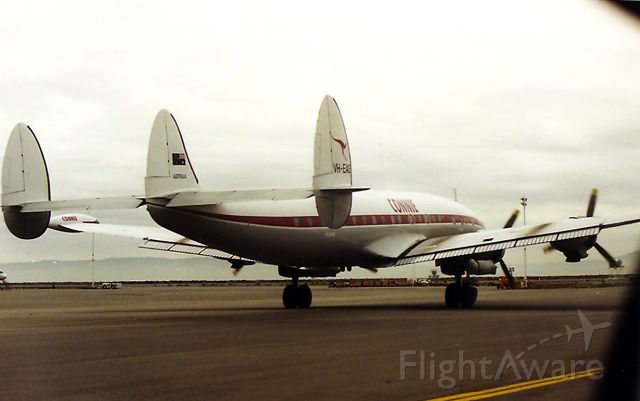 Lockheed EC-121 Constellation (VH-EAG) - KOAK - Chasing the HARS Connie to the runway. January 1995 never seen before photos of the HARS Connie departing for HNL. This plane had an engine problem and diverted to KOAK for repairs or I never would have seen it. I got a call at 5:30 am before work.  Get to OAK and contact George Midwin at the UAL maintenance facility - he'll get you a pass. I called in sick and loaded the film and raced the 1 hr and 45 minutes to KOAK in heavy traffic. More photos to follow.