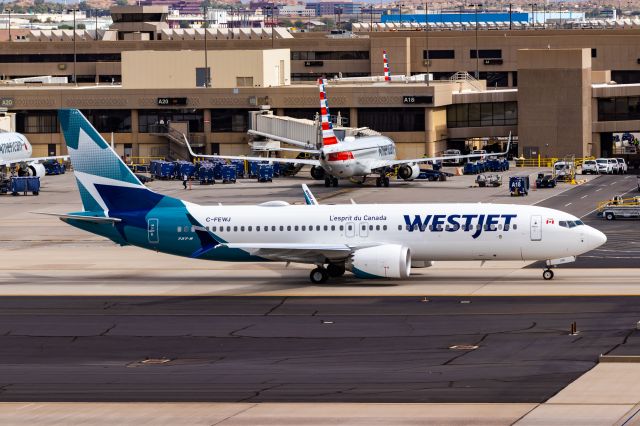 Boeing 737 MAX 8 (C-FEWJ) - WestJet 737 MAX 8 taxiing at PHX on 11/1/22. Taken with a Canon 850D and Tamron 70-200 G2 lens.