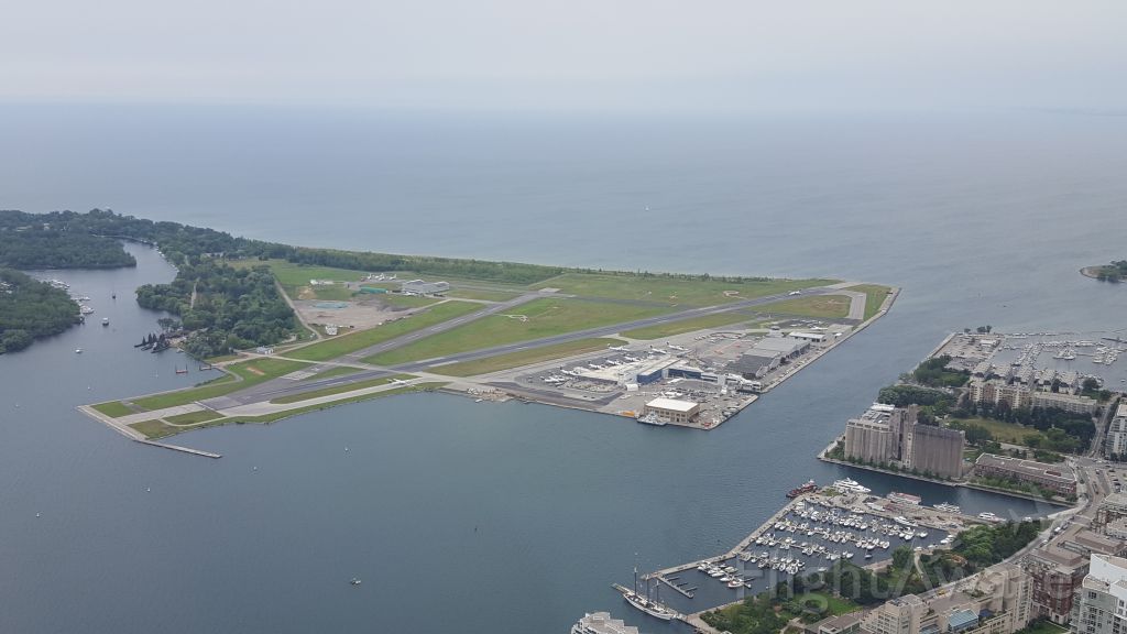 — — - From CN Tower - Dash 8 (Best guess ~ 13:18 departure time Aug. 17, 2017) about to take off; seen similar photo by miles wohl prior to mine... 