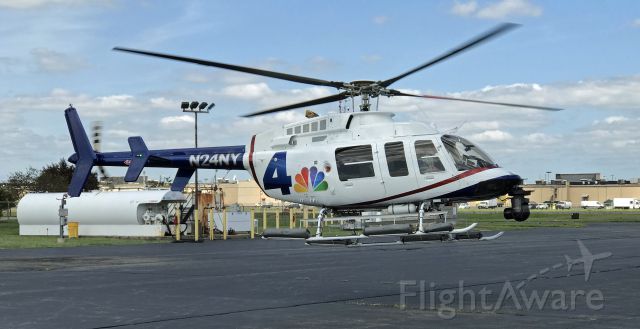 Bell 407 (N24NY) - LINDEN, NEW JERSEY, USA-AUGUST 26, 2019: A news helicopter from the NBC affiliate in New York City is shown taking off shortly after refueling.